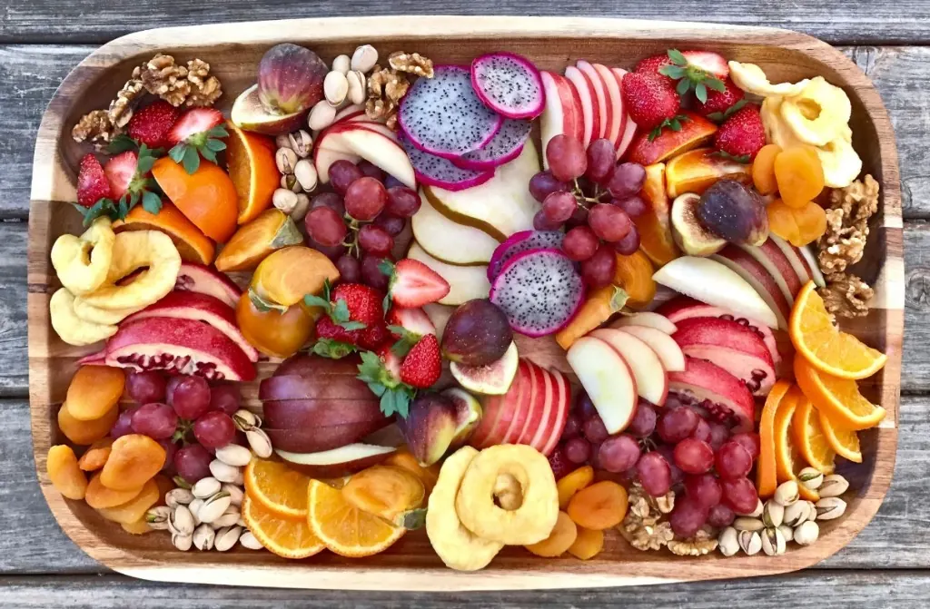 Tropical fruit platter breakfast with fresh juices