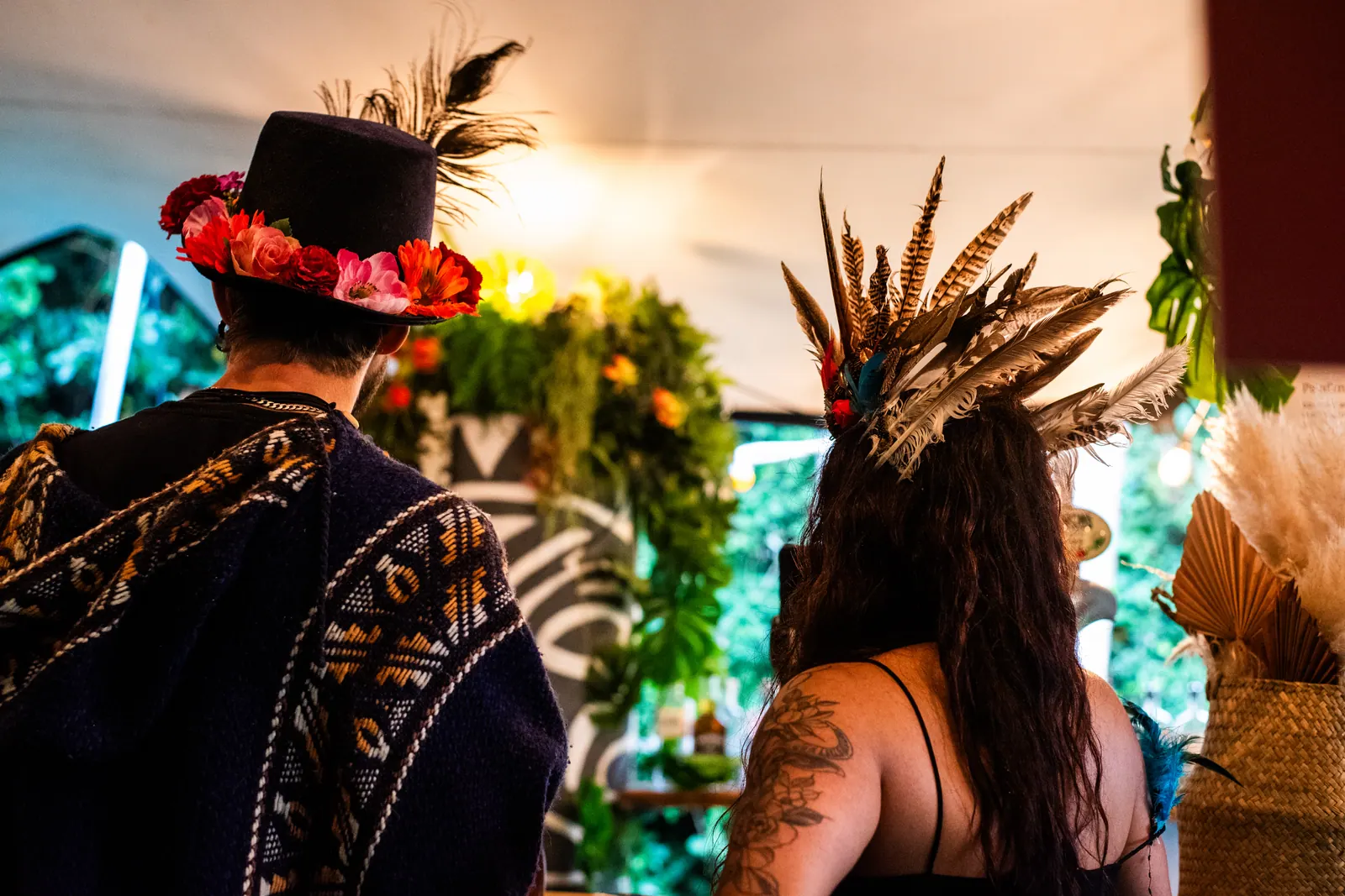 Feathered headdresses and knit ponchos in the crowd