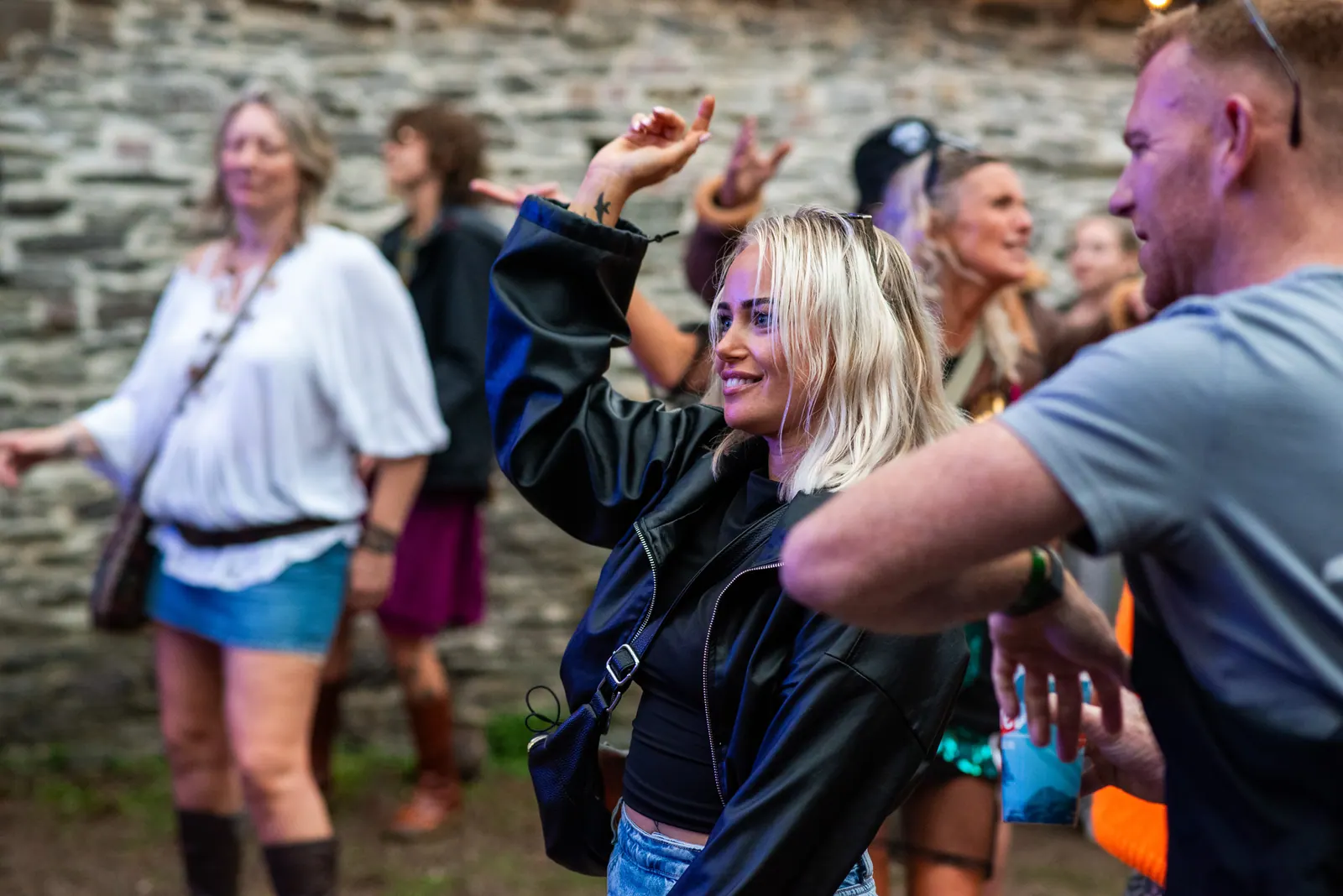 Dancing in front of the stone wall